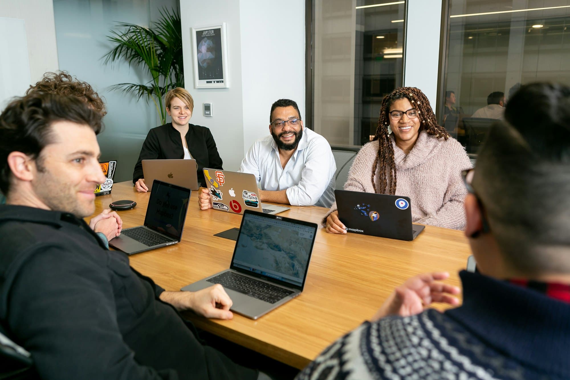 A delivery team around the table, working through a deployment
